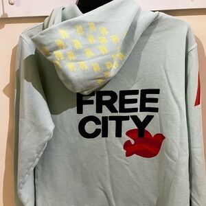 Freecity Light Blue Hoodie with Yellow and Red Accents